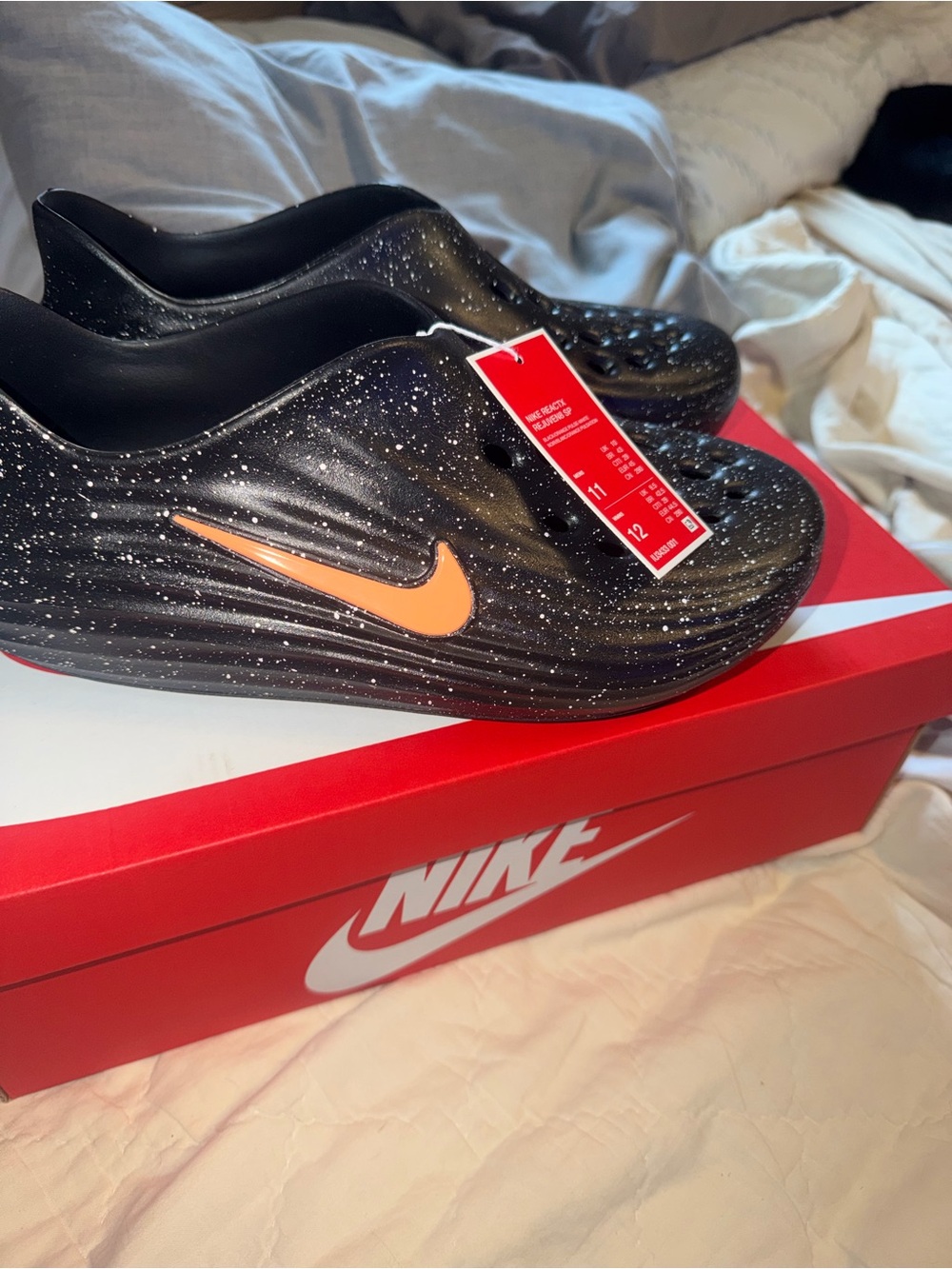Nike Mens Rejeven8 Black Signa ; New Release Black Speckle Slide w Orange Swoosh